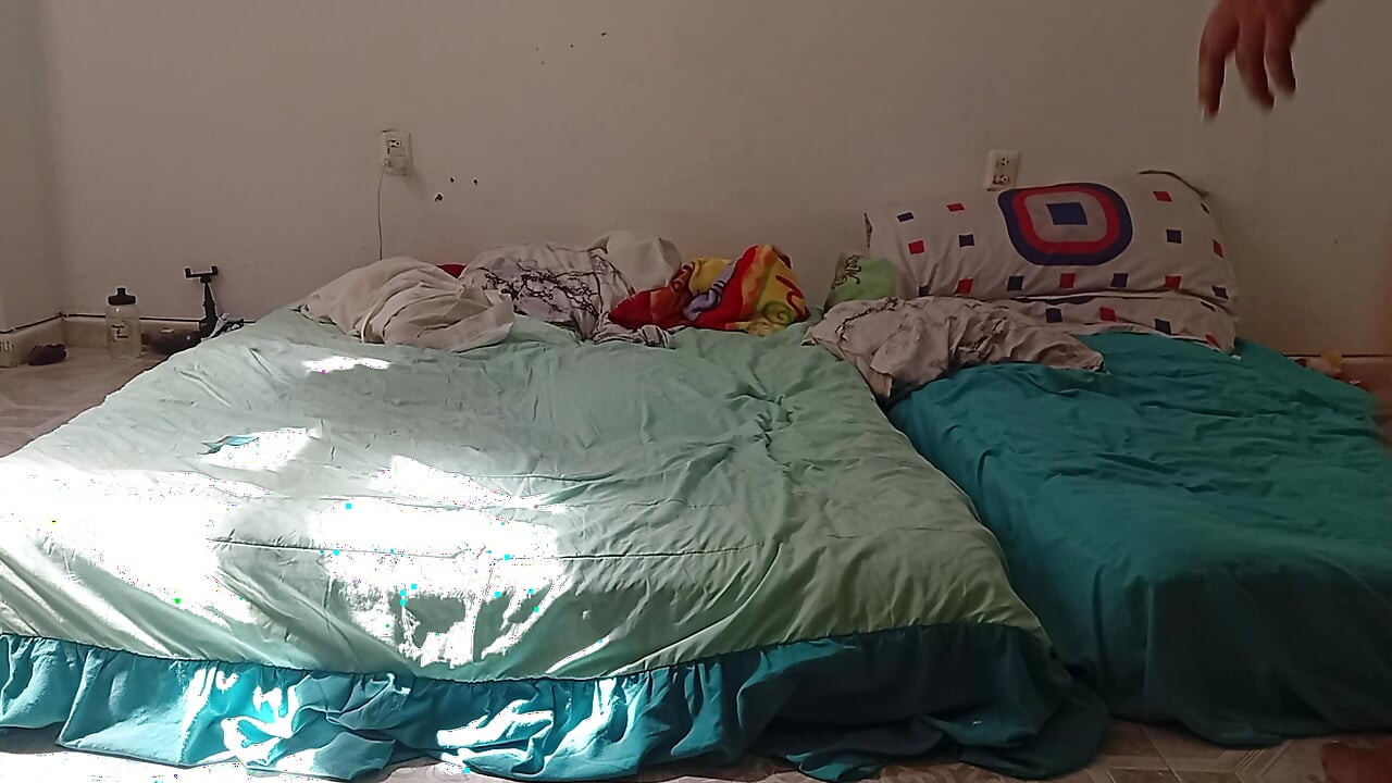 Mexican mother-in-law cleaning guest room in thong