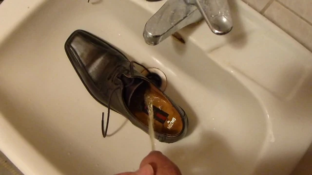 Piss in men's dress shoe