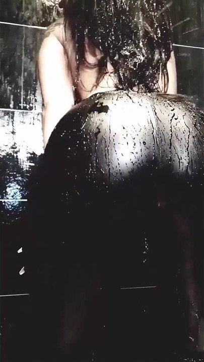 Tattooed MILF Teases Her Curves in Wet Leather