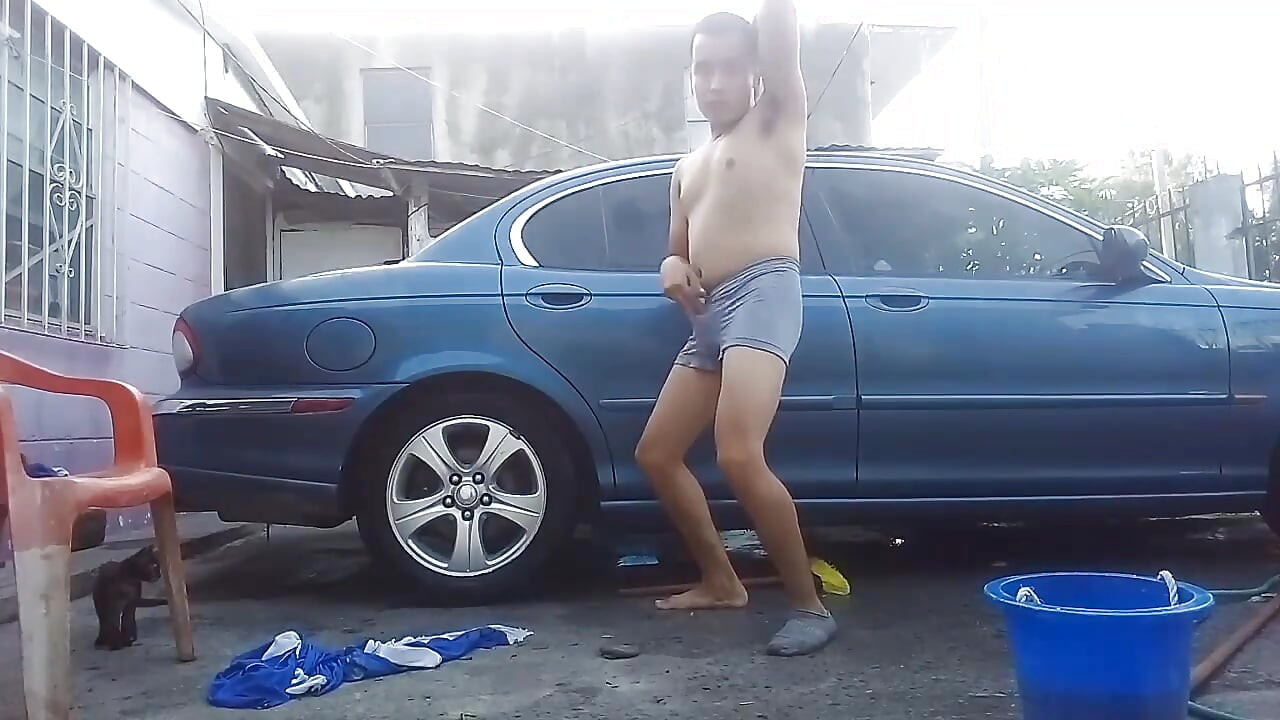 Jesus in gray boxer washing his jaguar car
