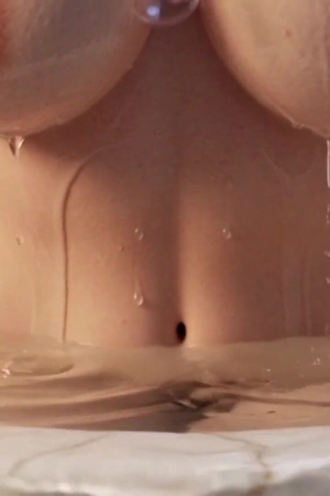Two Curvy Mature Women Naked in Luxurious Marble Bathtub Sensual Wet Bodies Glistening with Water and Bubbles