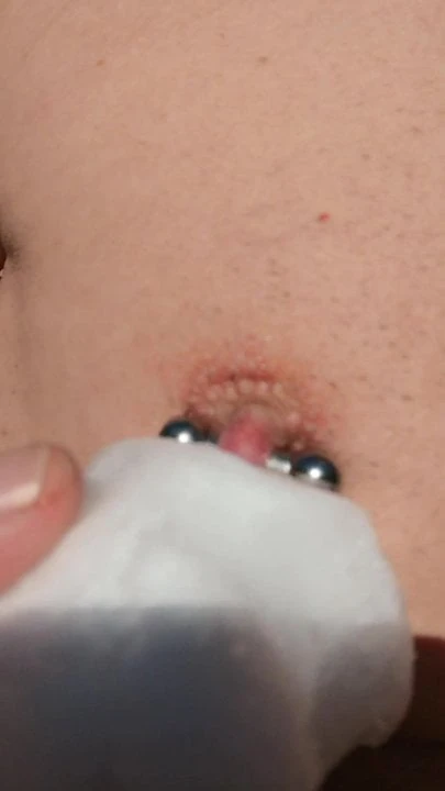 Playing with Snow On Cock, Balls, and Pierced Nipple