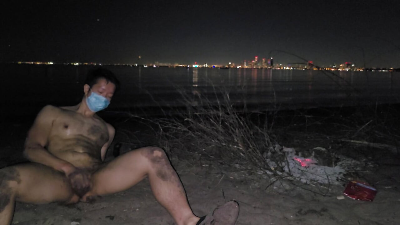 oiled masturbating and piss on the nude beach at night