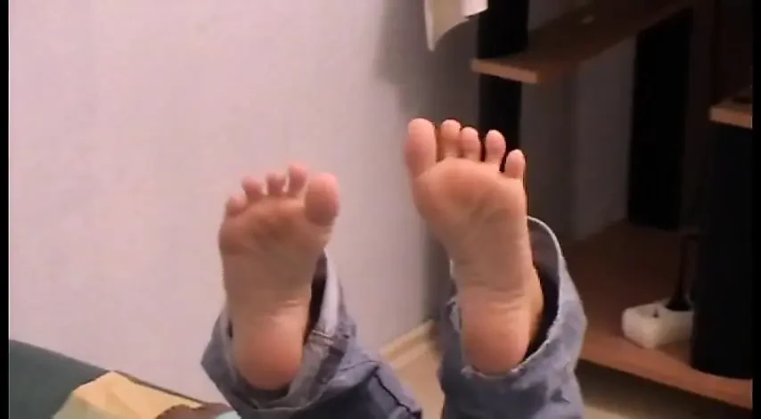 Reading newspaper and relaxing tired feet