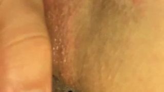 analplug and wet, swollen pussy with pussyballs inserted