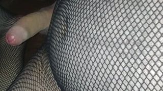 Playing in fishnet boddystocking