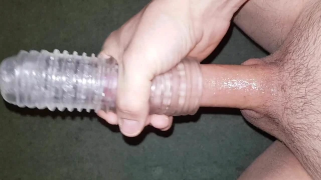 Playing with cock sleeve