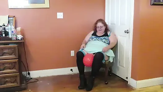 Nurse Vicki  plays with a rubber ball in a mini skirt, sexy stockings and high heel mini boots