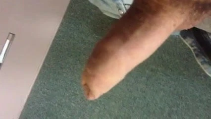 Stroking my uncut cock at work