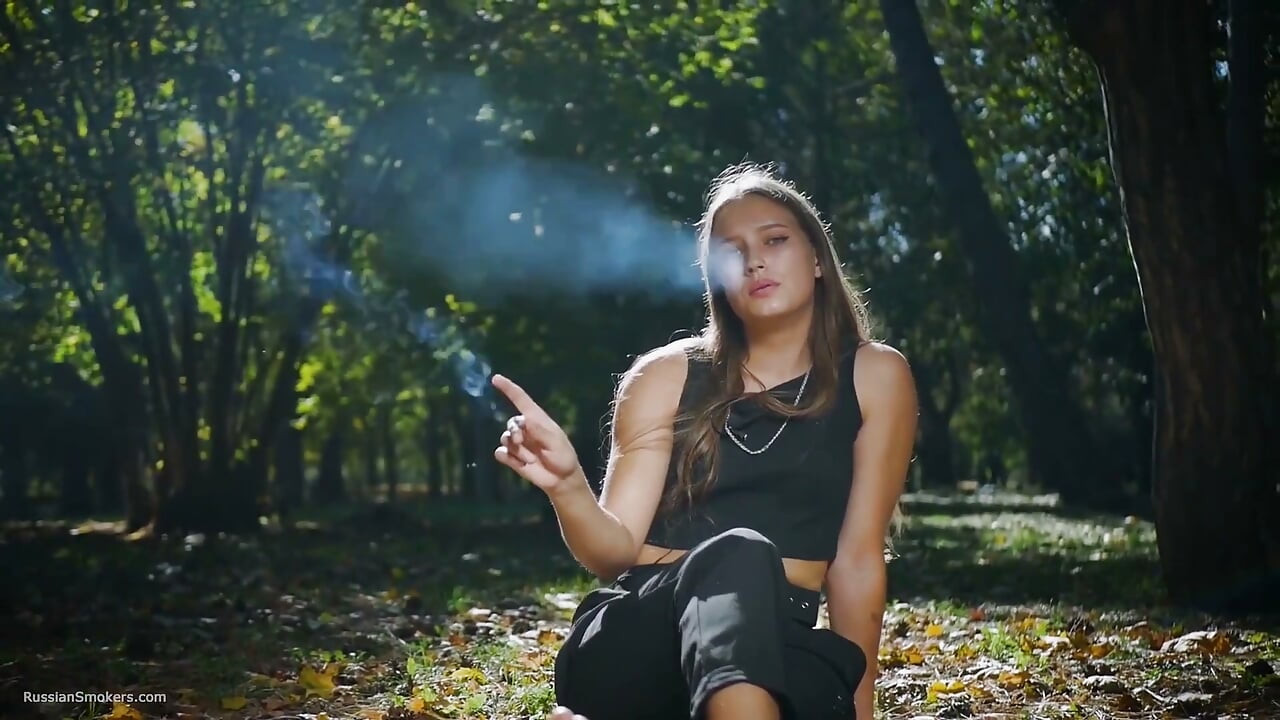 Seductive Russian Beauty Smoking Cigarette in Studio