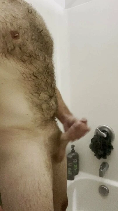 Stroking cock in the shower