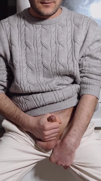 Captivating moment from "A young guy jerks off his dick and cums loudly"
