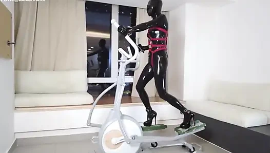 Mz27 - a Girl Bound in Latex Walks on a Treadmill