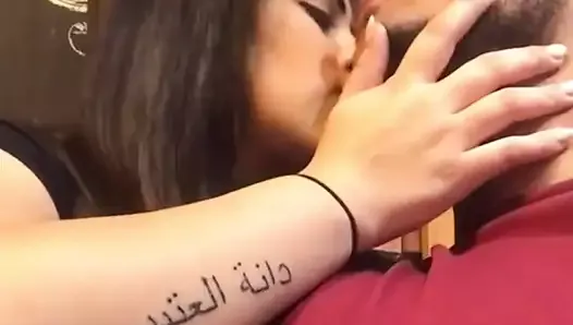 arabian couple kissing in public