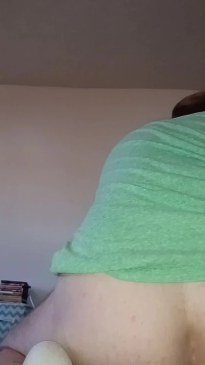 From behind