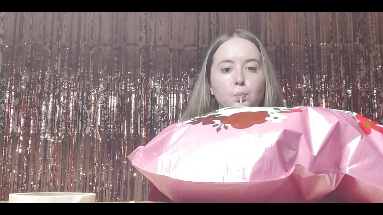 Getting Ready for Valentine's Day by Inflating Balloons