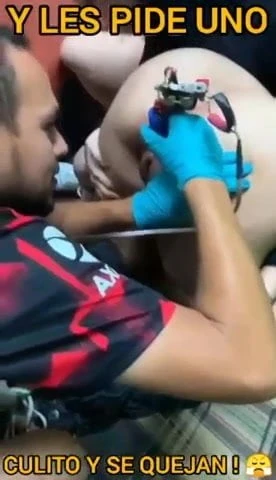 Getting her asshole tattoed