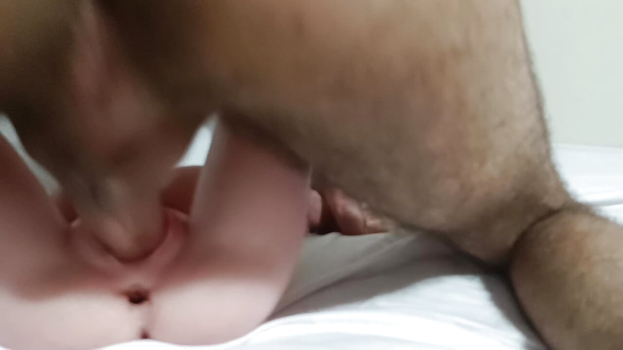 Fucking a sex doll on the bed