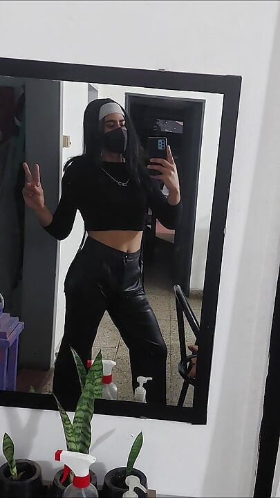 Crossdresser public walk wearing leather pants