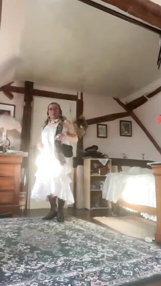 In white dress with ruffles