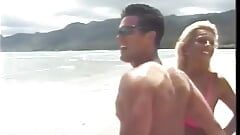 Tanned blonde and a dude are fucking on the beach