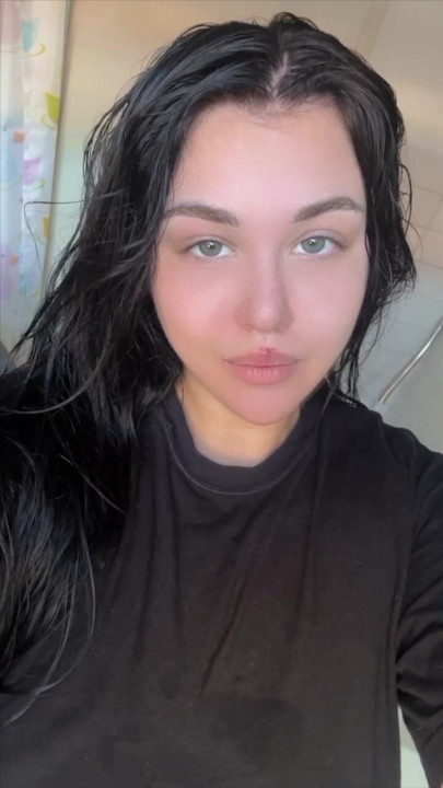 After a shower, a beauty is thinking about how to entertain herself now