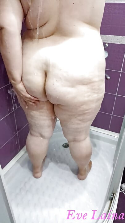 Stepmom with big boobs and big butt takes a shower before s