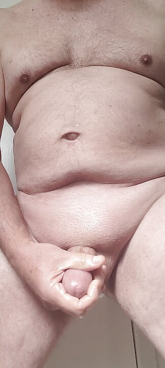 Solosexual strokes my shaved, oiled up cock to get a load of cum to swallow