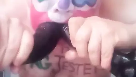 Fag Jester Stuffing its Cock-Whore Mouth with Dildos