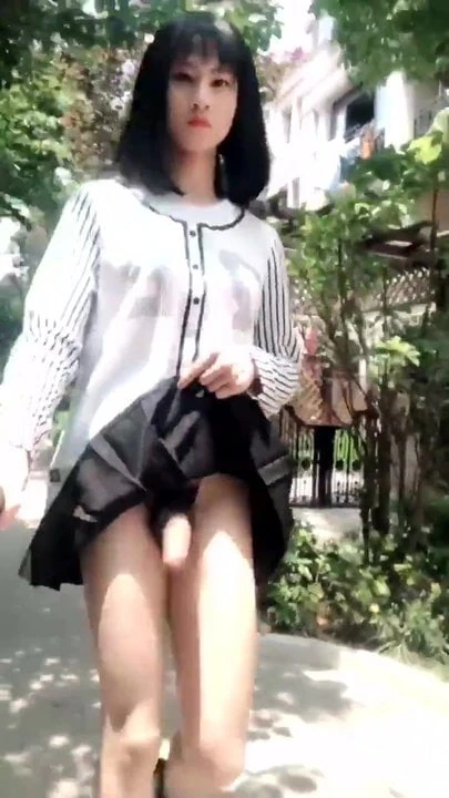 Crossdresser outside showing clitty