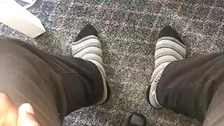 Young African feet out in socks in the office