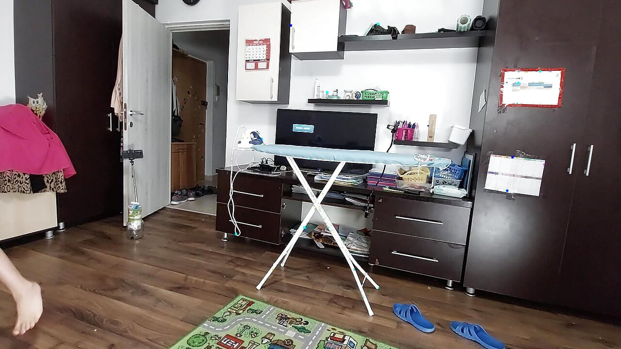 Sexy brunette doing naked chores around the house.