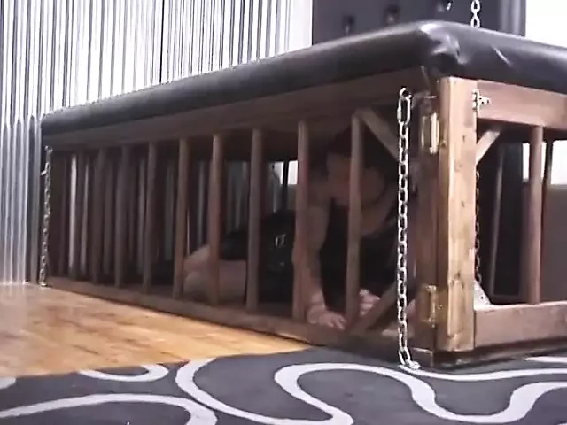 Hot dominatrix duo paddles their dude captive's ass over table