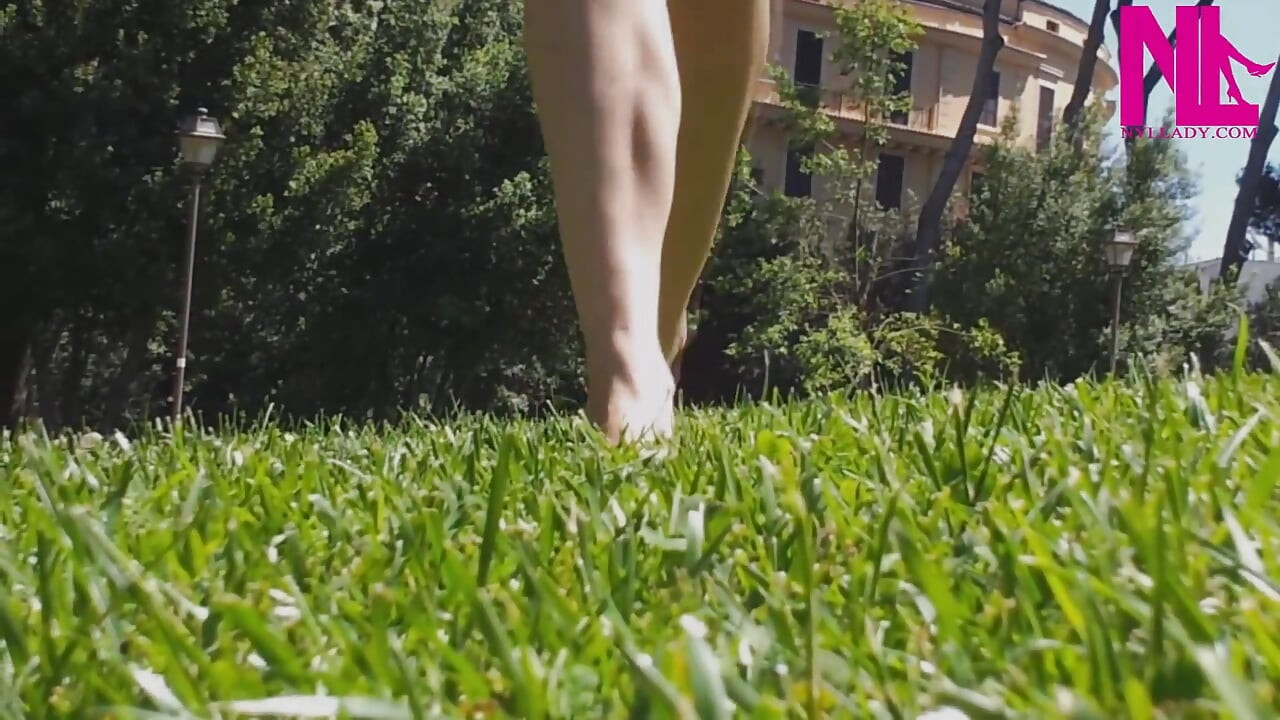 Nyllady Walking Barefoot on Th Grass in a Park