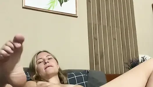 Gentle masturbation of a beautiful blonde's wet pussy. Close up  to the camera.