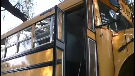 Cute schoolgirl takes it from behind on a school bus