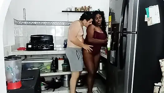 Brunette girl gives cream pie in the kitchen