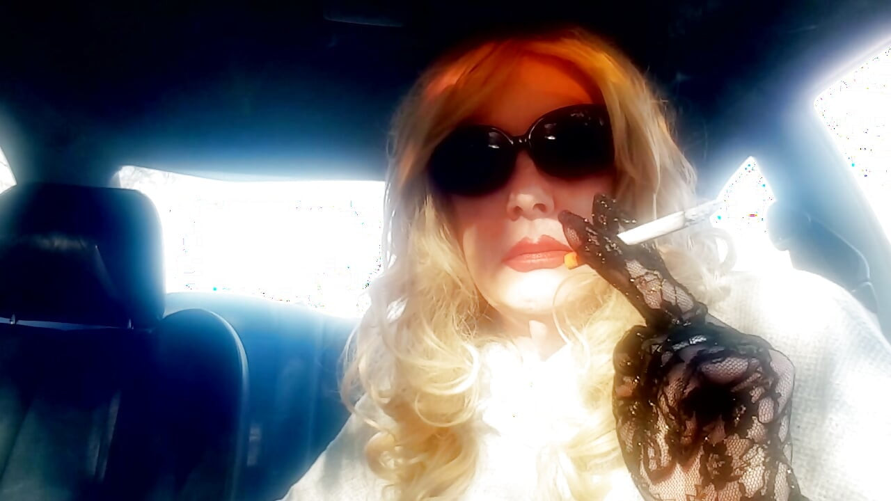 MRS. ROMAN SMOKING MARLBORO 100's IN HER CAR