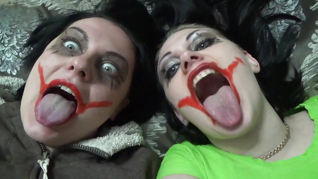 Two crazy clown girls dangle you above their hungry mouths before fighting over who will eat you alive