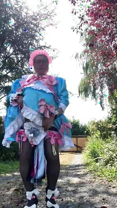In a blue maid outfit with pink bows for a day