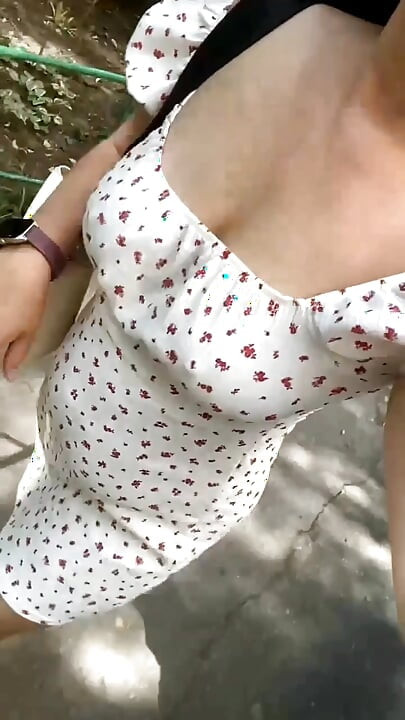 A MILF walks around the city and touches her pussy.