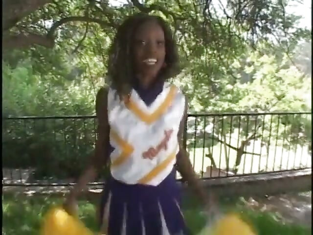 Pretty ebony cheerleader enjoys white cock banging