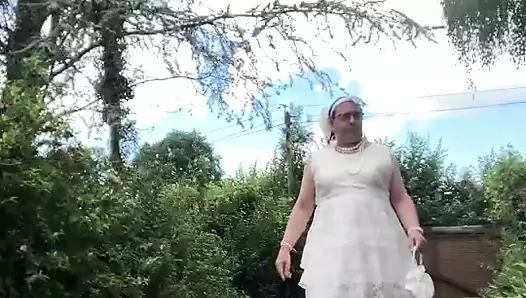 In an outfit with a long white dress for an evening.