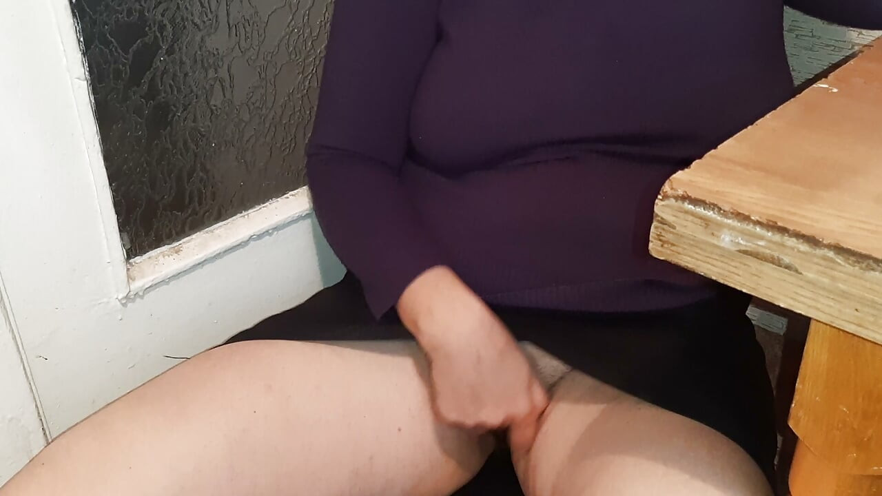 A female teacher masturbates daringly beneath her miniskirt in a shared university kitchen