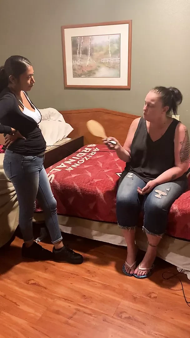 White girl gives Latina girl a spanking