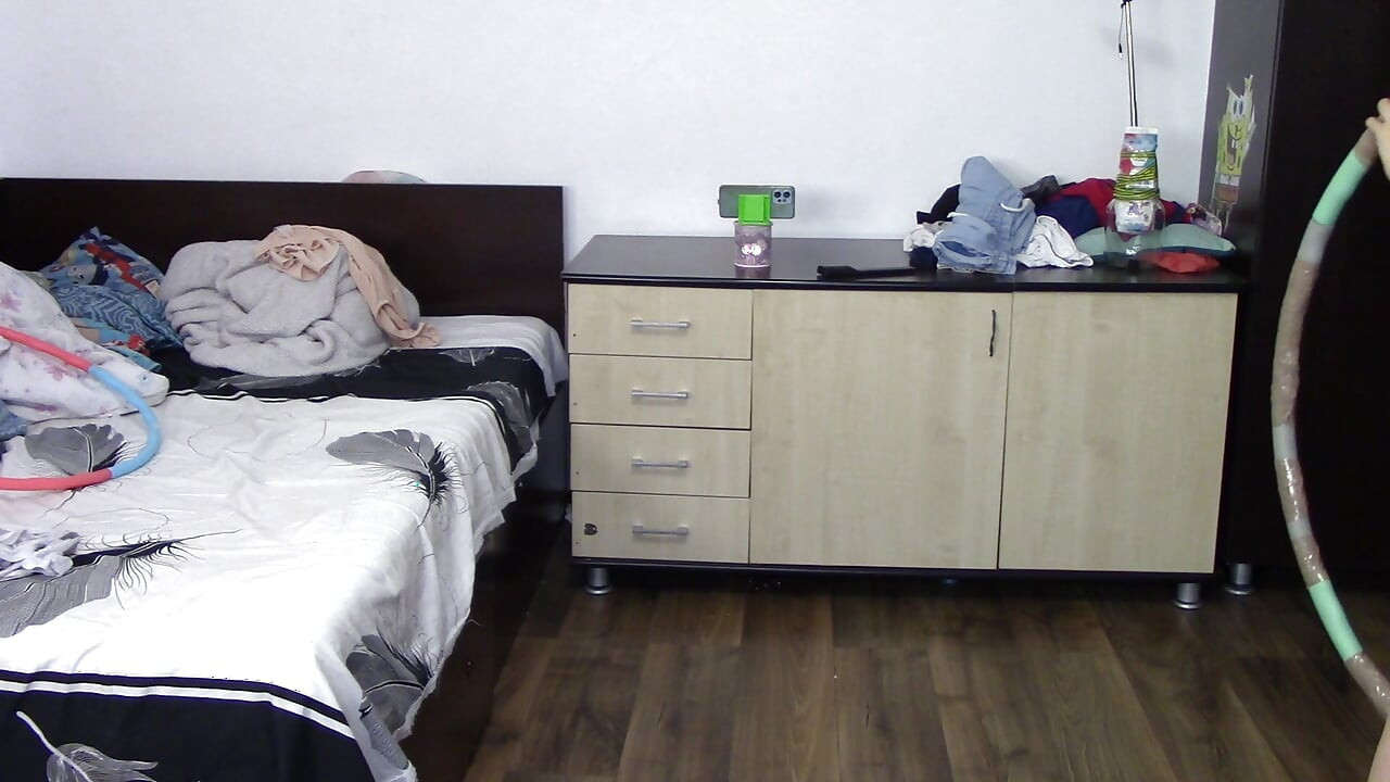Sexy woman trains naked at home. Sexy brunette tries on pantyhose, hairy pussy, big ass, big tits.