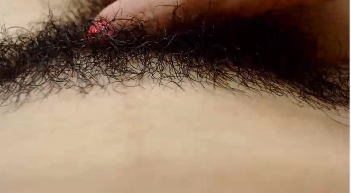 Mexican slut runs her fingers through her hairy pussy