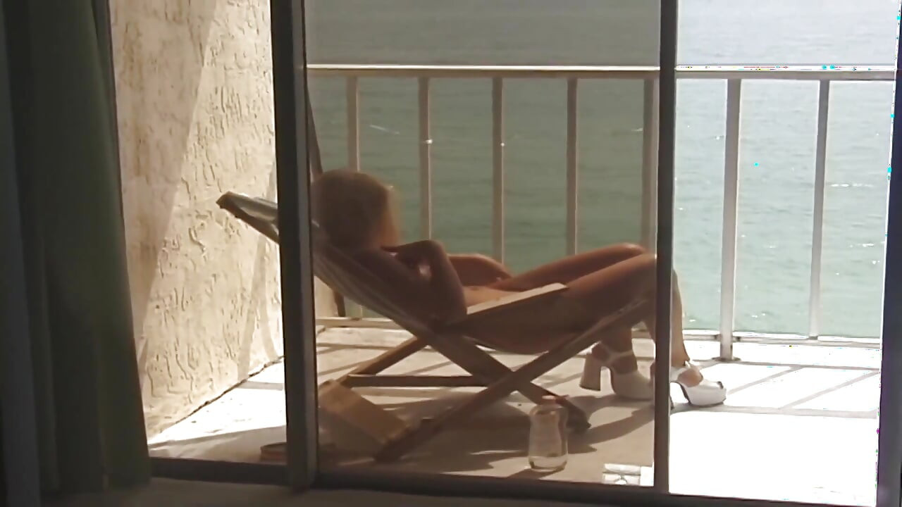 Hot blonde lotions up her perfect body