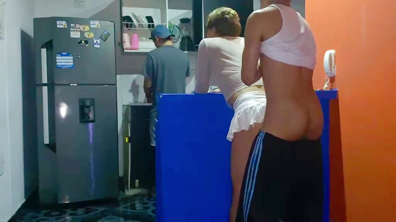 FEMBOY GETS FUCKED BEHIND HER BOYFRIEND'S BACK IN THE KITCHEN