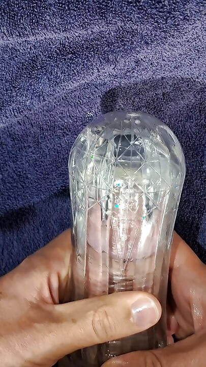 Guy using see through masturbator